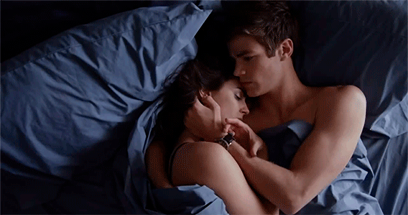 Couple kissing in bed gif